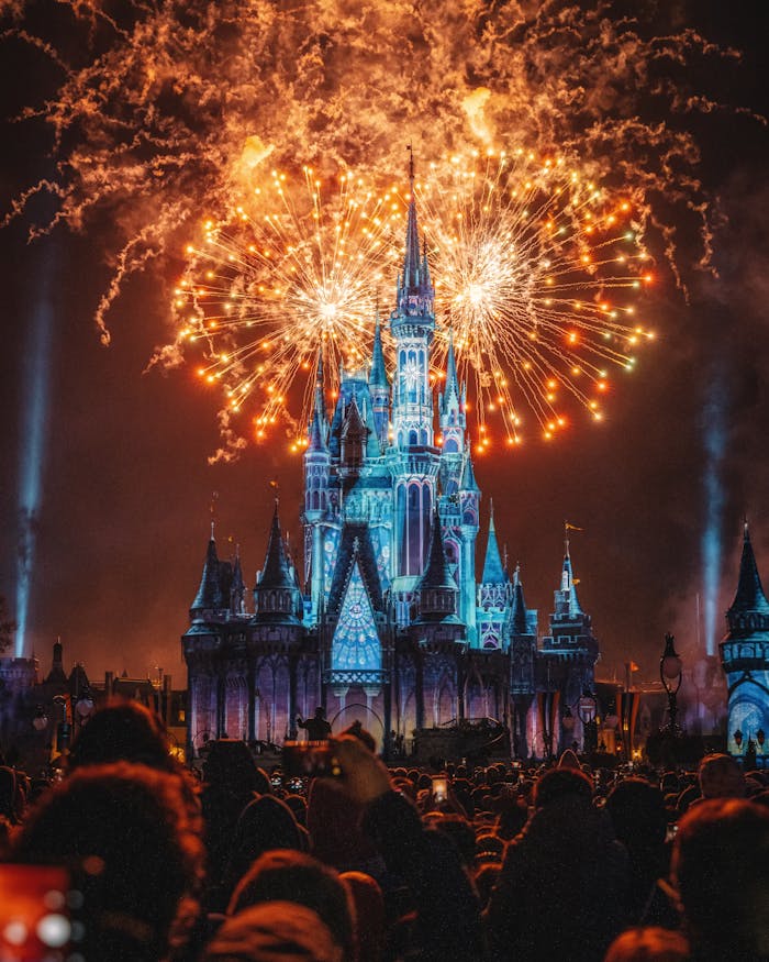 Enchanting fireworks illuminate the iconic castle at night, creating a magical celebration atmosphere.